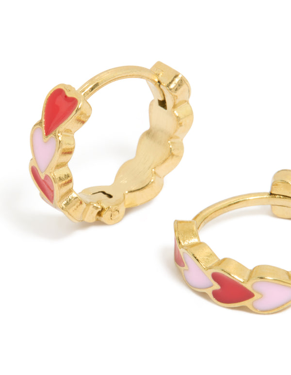 Designed with waterproof gold plated stainless steel red and pink enamel heart huggie earrings in coral close up view