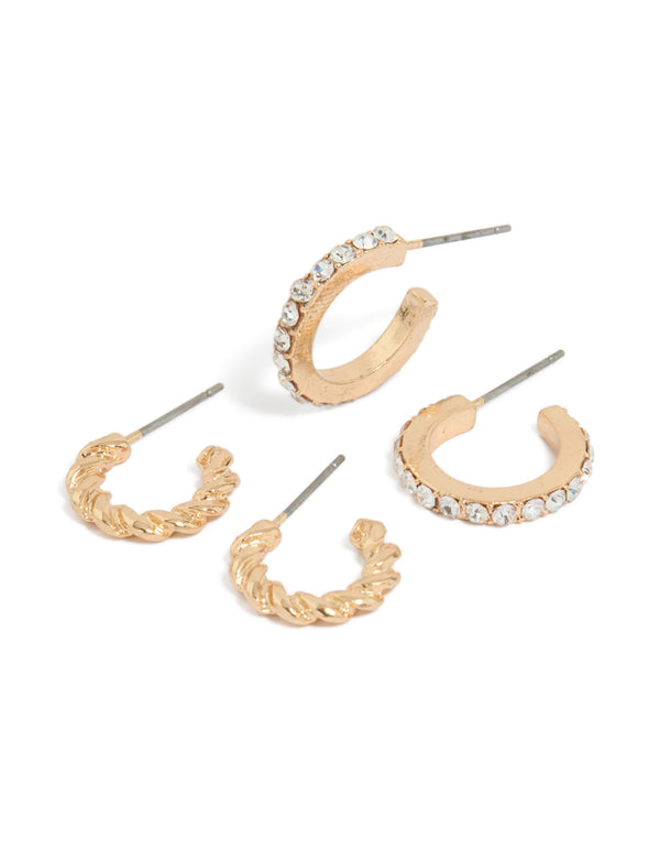 Showcasing a gold twisted and diamante open hoop earrings pack front view