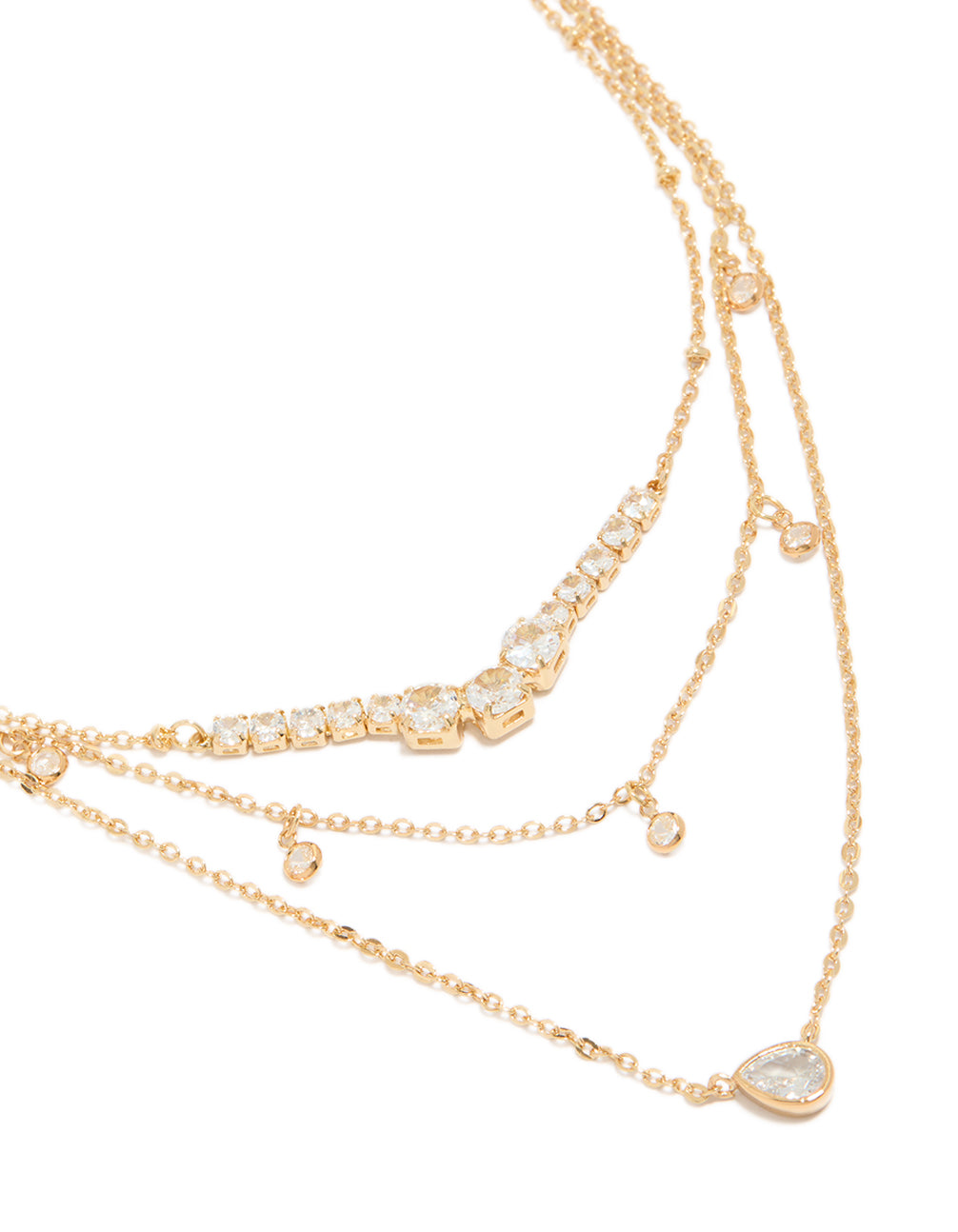Showcasing a gold plated cubic zirconia tennis and pendant layered necklace with charm featuring dainty styling close up view