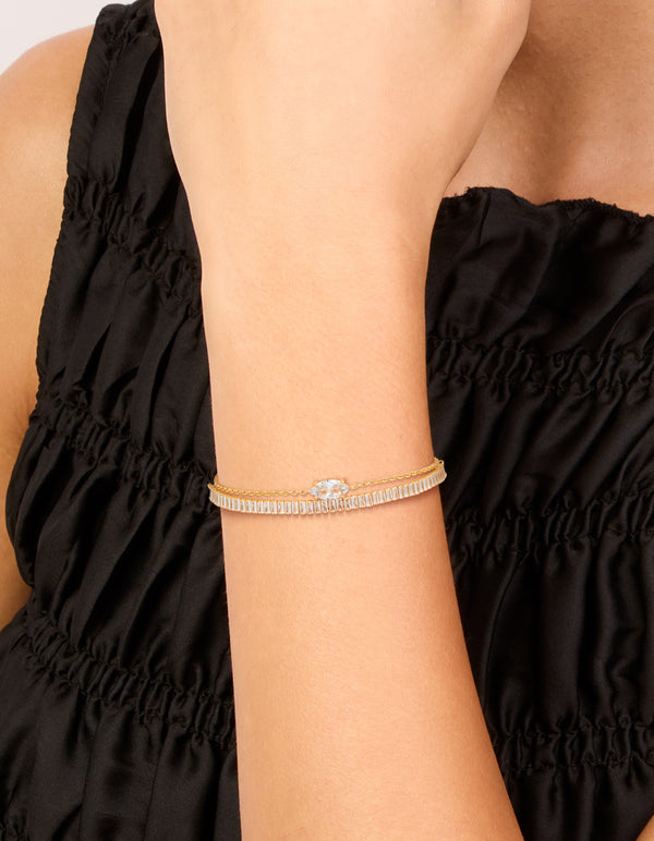 Featuring gold plated cubic zirconia bracelets with marquise, baguette, stone cuts on wrist view