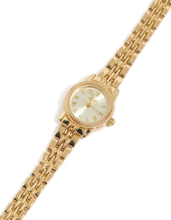 Elegant gold plated mini round watch with silver dial featuring roman numerals, women's analog design, link band strap in statement formal style watch face detail view