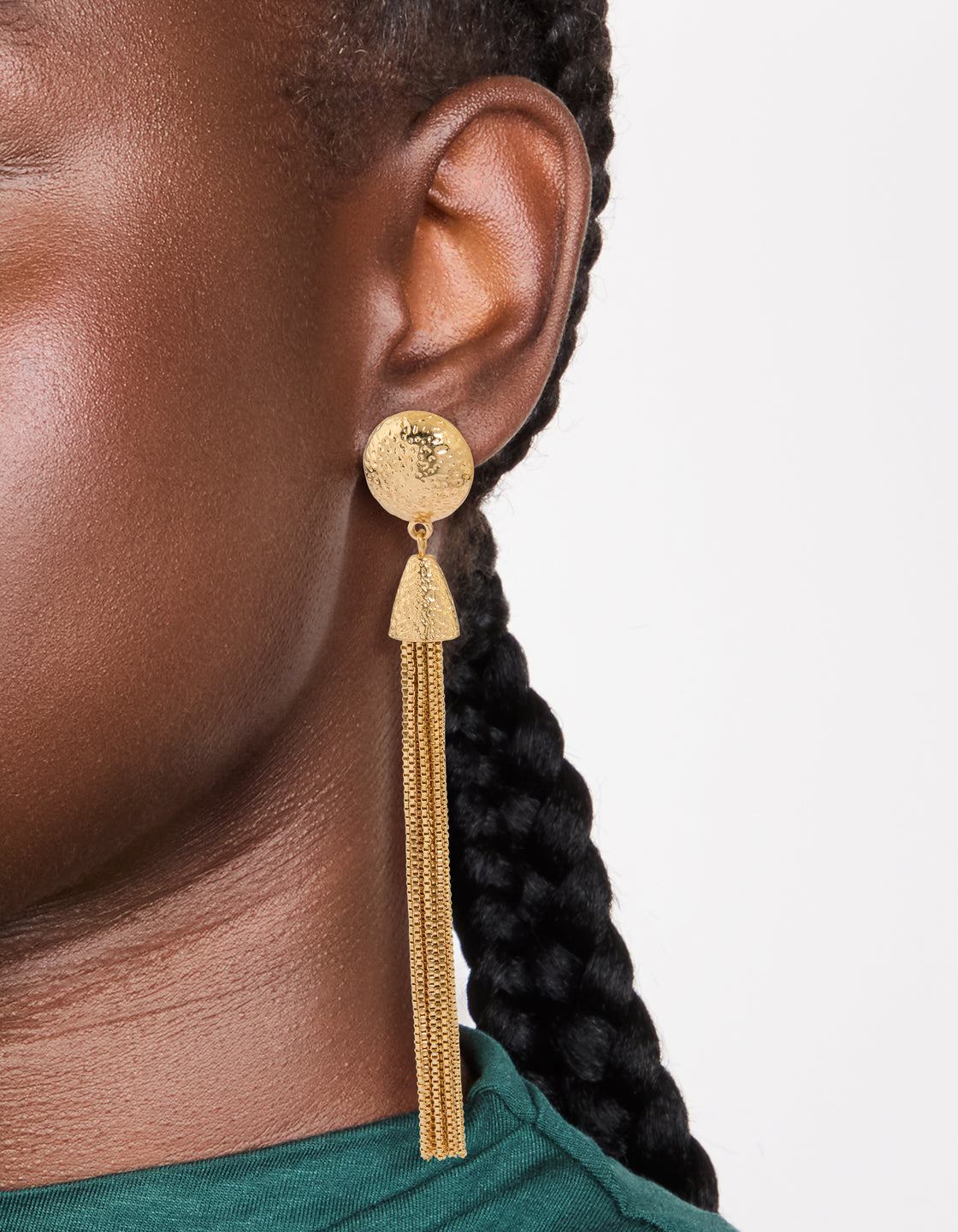 Crafted with statement style gold dome tassel drop earrings on ear view