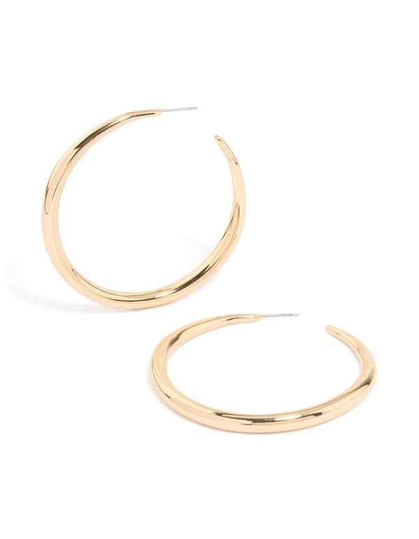 Showcasing gold thin plain hoop earrings with closure in front view