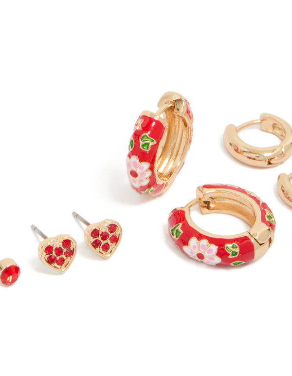 Crafted from gold red enamel huggie and stud earrings in a 3-pack with floral heart leaf patterns featuring cubic zirconia white green details close up view