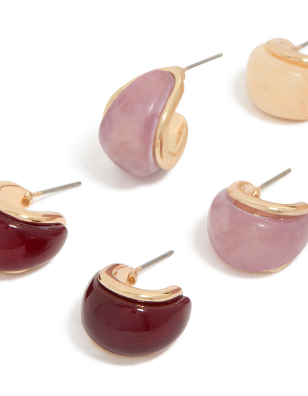 Showcasing chunky statement hoop earrings in gold, burgundy, and pink acrylic bubble 3-pack close up view