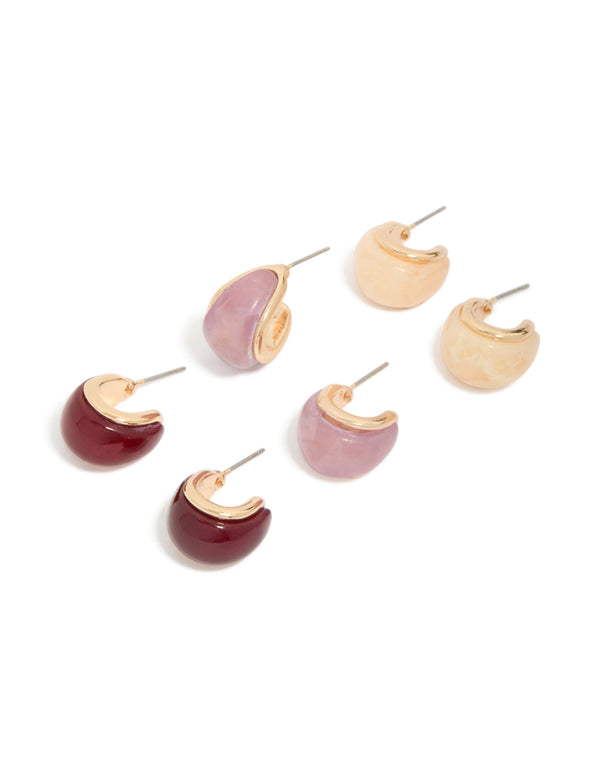 Featuring chunky statement hoop earrings in a 3-pack with gold, burgundy, and pink acrylic bubble design front view