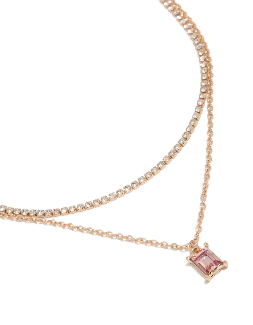 Showcasing a gold cupchain pink baguette layered necklace featuring baguette stone cut close up view