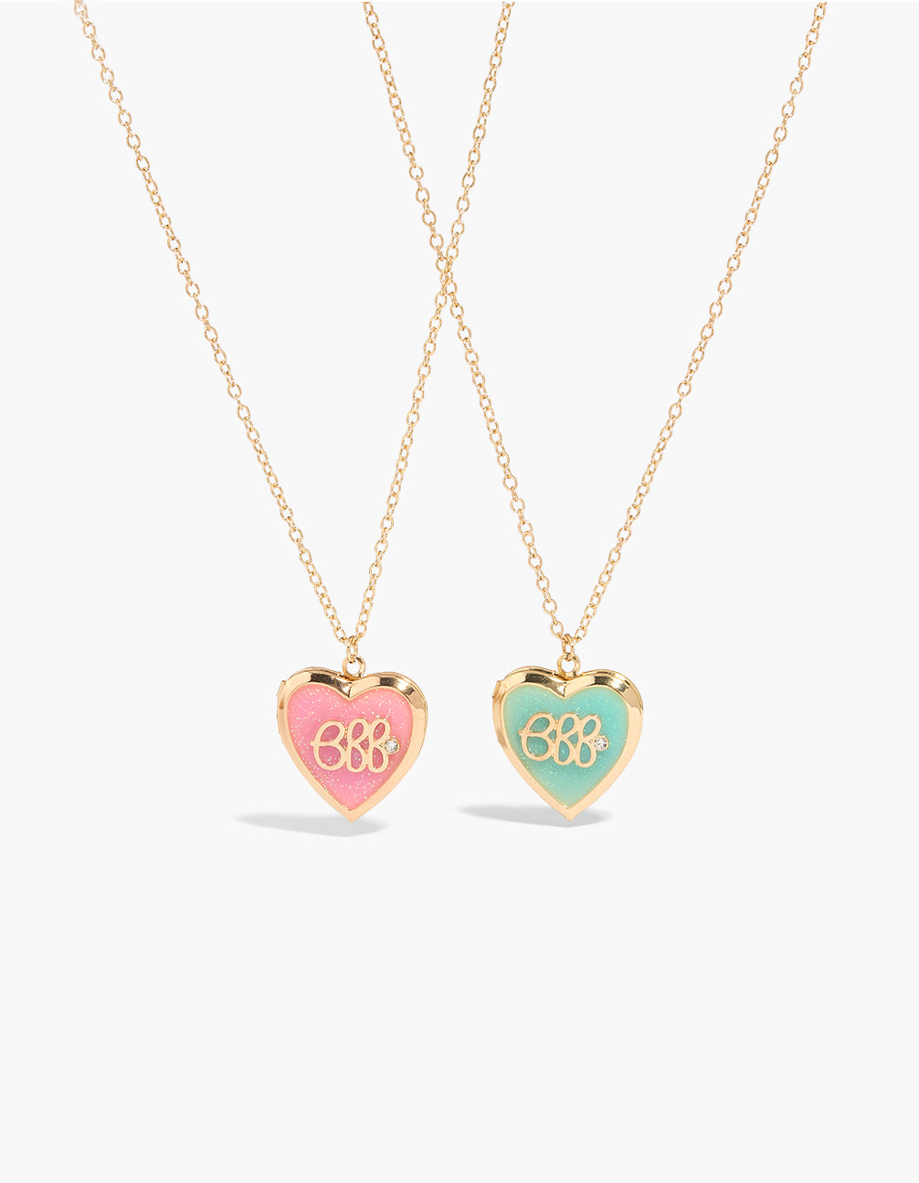 Showcasing kids BFF jelly locket necklaces in a 2-pack with script heart glitter stainless steel gold pink turquoise front view