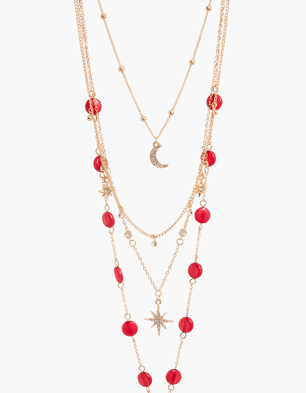 Showcasing a gold celestial and red beaded Y-necklace featuring layered chains with ball accents including star and moon motifs close up view