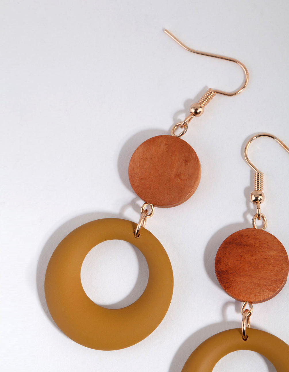 Displaying wooden matte olive drop earrings with matte finish in sienna, goldenrod, peru and gold tones post detail view