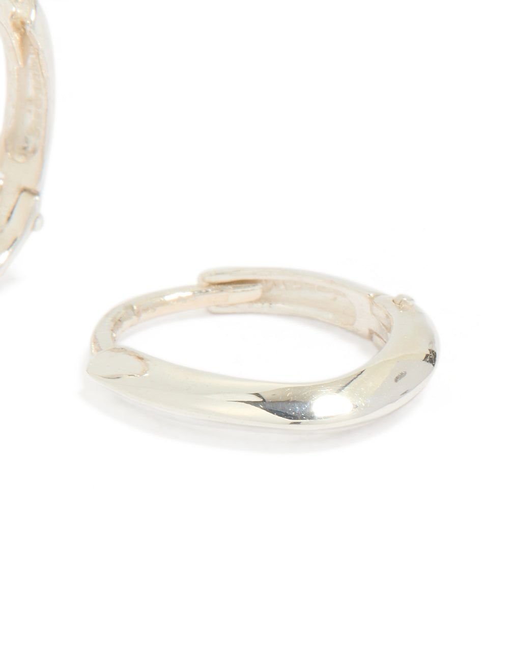 Displaying chubby hoop earrings crafted from sterling silver with oval cut and polished finish post detail view