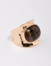 Showcasing a tortoiseshell pattern statement chunky stone band ring in gold side detail view - link has visual effect only