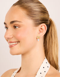 These statement bow earrings with pear cut crystal in gold plated sterling silver on model view - link has visual effect only