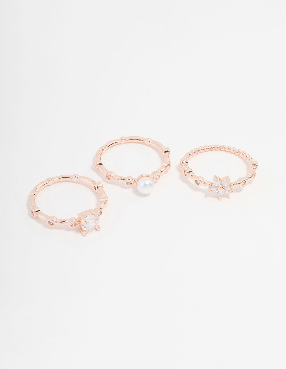 Discover this rose gold plated cubic zirconia pearl bamboo ring in a 3-pack featuring floral design dainty styling front view