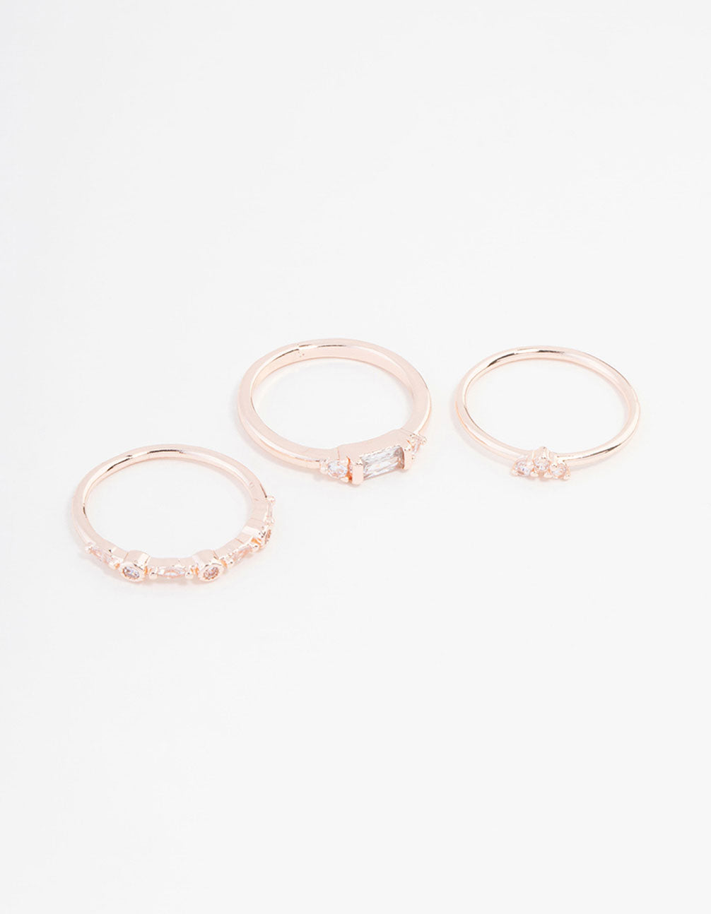 Showcasing a rose gold plated baguette and mini round cubic zirconia ring 3-pack front view