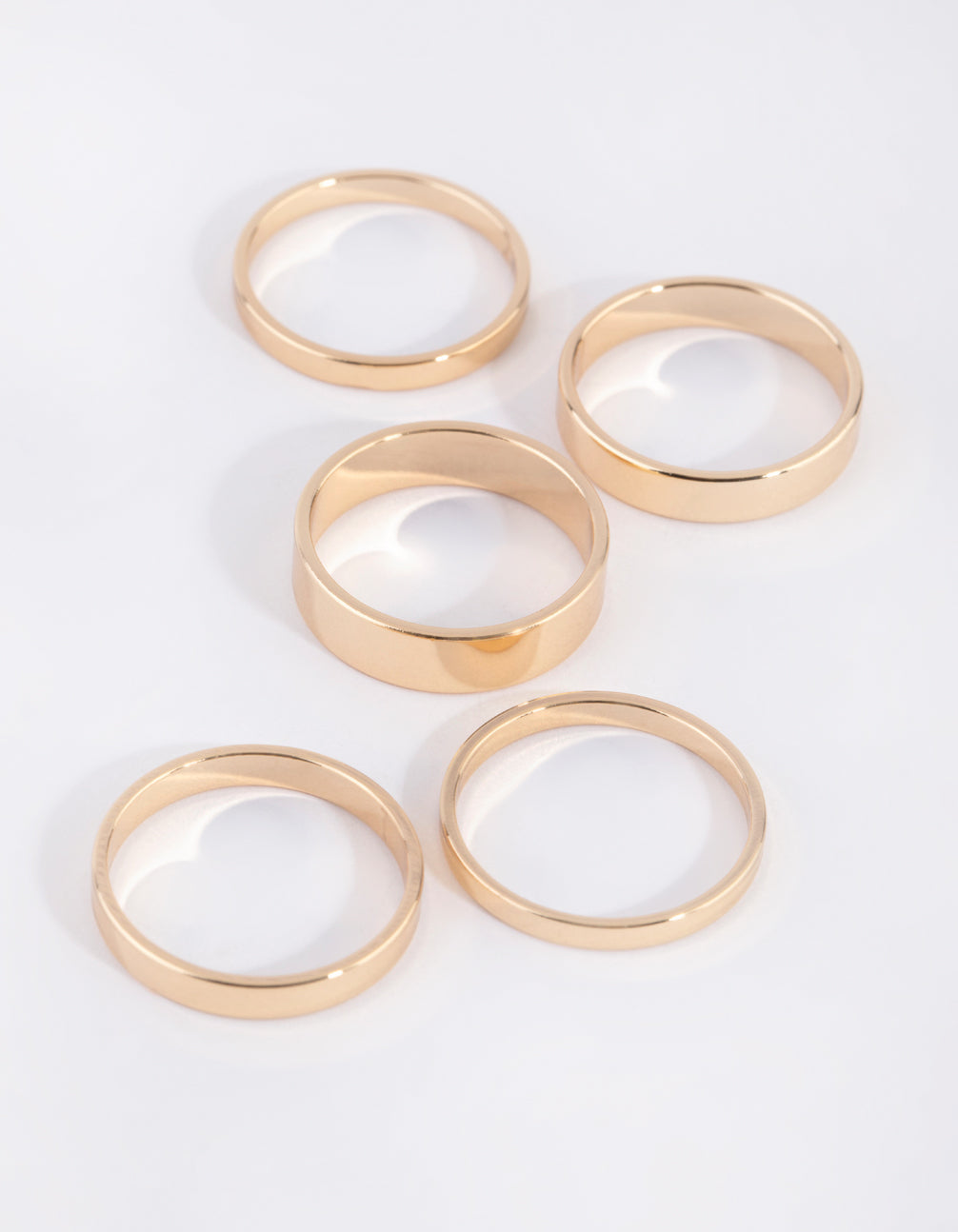 Set of gold flat band rings in 4-pack front view
