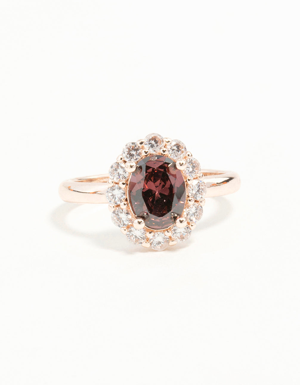 Elegant rose gold pink stone engagement ring with statement design close up view