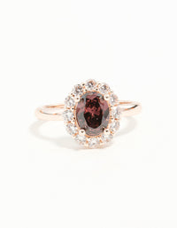 Elegant rose gold pink stone engagement ring with statement design close up view - link has visual effect only
