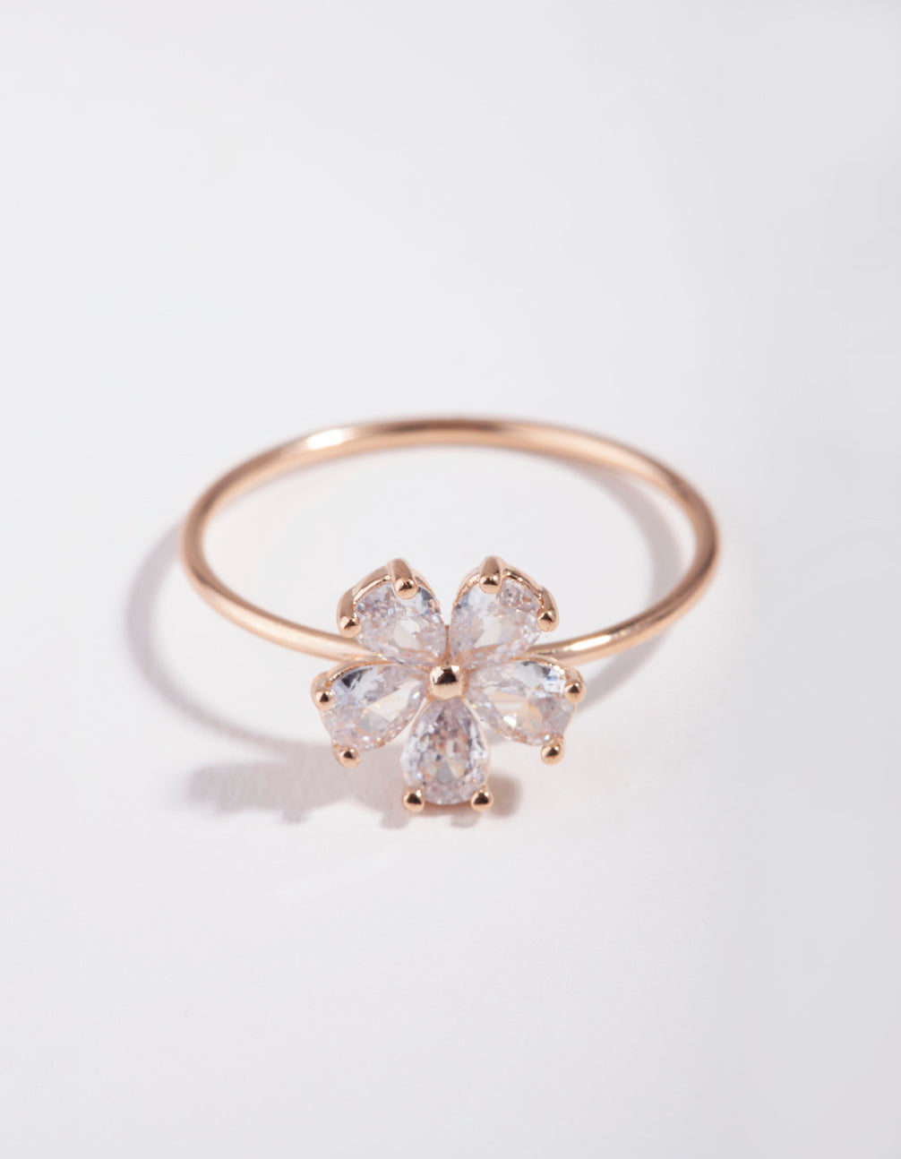 Beautifully crafted floral cubic zirconia ring in rose gold with daisy motif close up view