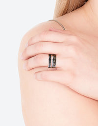 Featuring celestial silver symbol mood ring set with black and gold detailing on finger view - link has visual effect only