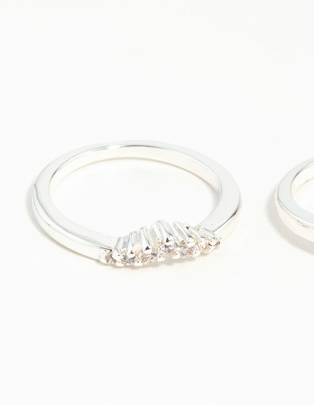 Highlighting silver plated stackable rings featuring round cut cubic zirconia in white close up view