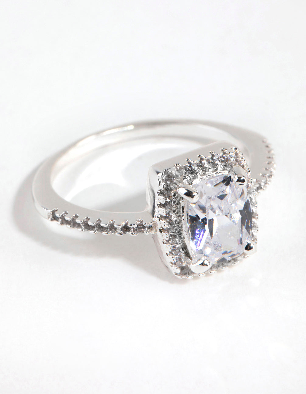 Crafted from silver plated metal, this cubic zirconia surround stone ring front view