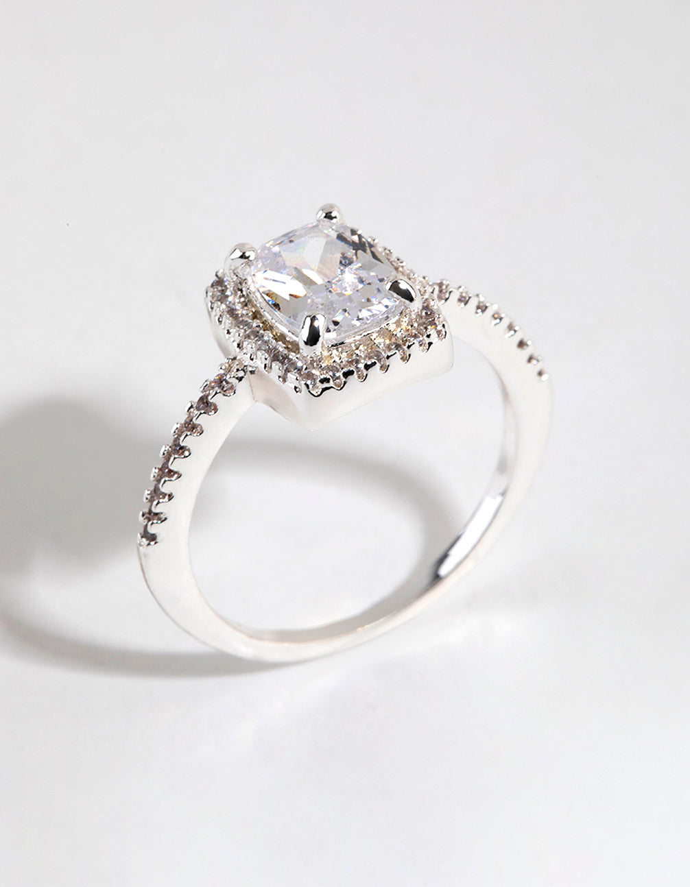 This silver plated cubic zirconia surround stone ring showcases intricate clear halo detailing close up view