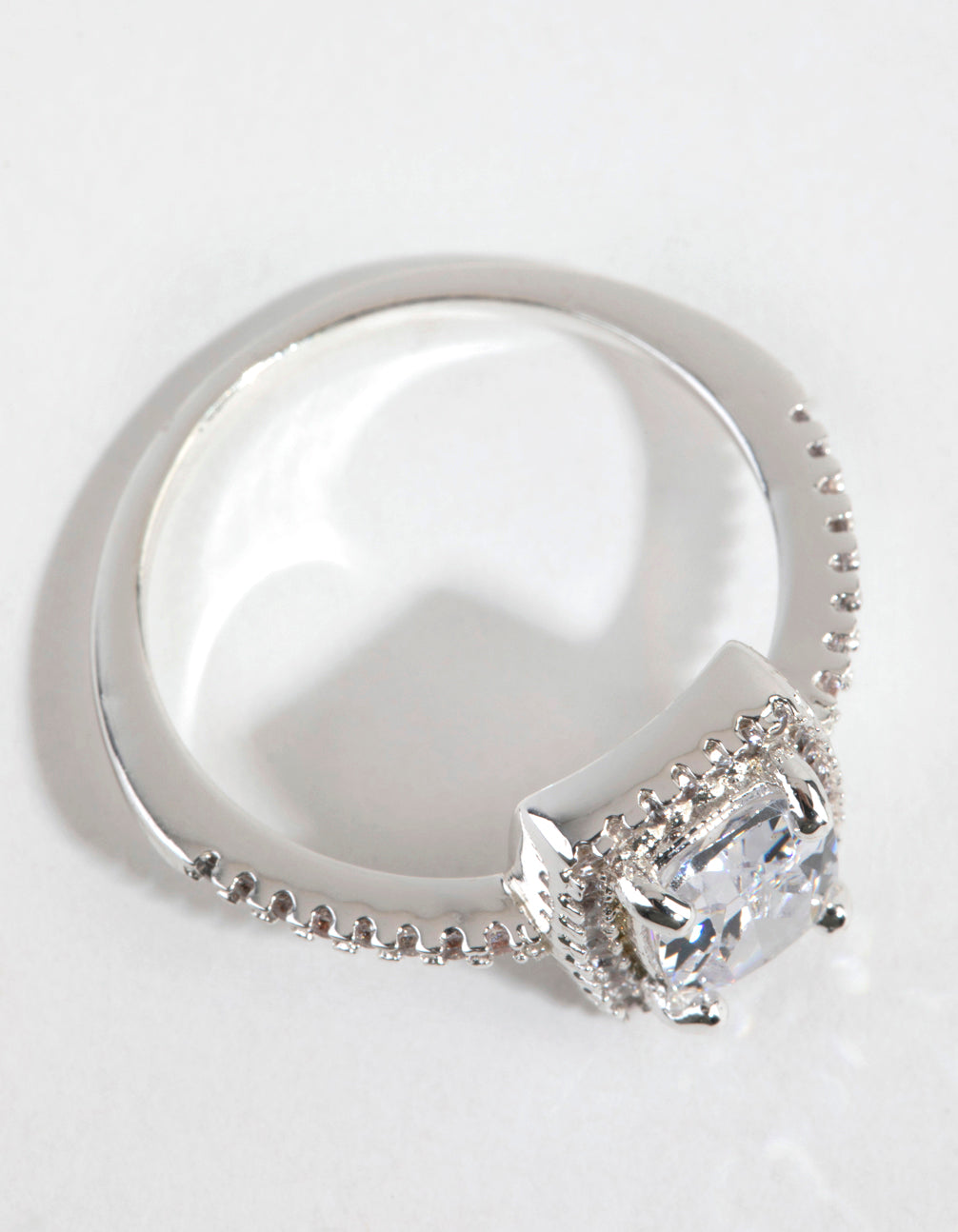 Featuring silver plated construction with cubic zirconia surrounds in clear, this ring offers side detail view