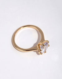Crafted from gold plated material this round cubic zirconia ring highlights clear stone detailing side detail view - link has visual effect only