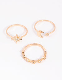 Showcasing gold stacking rings in a 3-pack featuring celestial star details front view - link has visual effect only