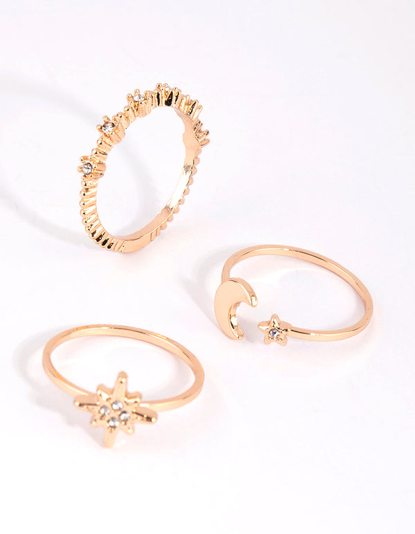 Crafted from gold with celestial star accents in a 3-pack stacking rings side detail view