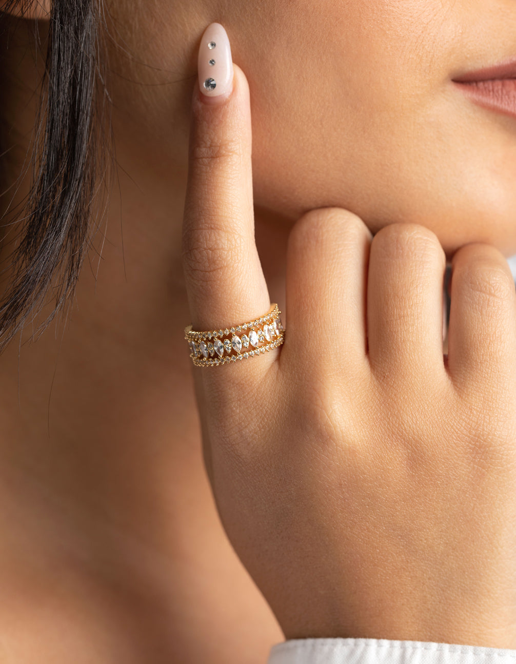 Elegant gold plated ring with cubic zirconia on finger view