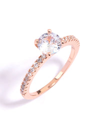 Elegant rose gold plated cubic zirconia ring with round cut stones and textured band in statement style front view - link has visual effect only