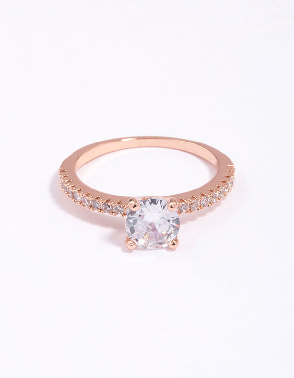 Beautifully crafted rose gold plated cubic zirconia ring featuring round cut stones with textured band design close up view