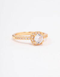 Crafted from gold plated metal, this mini cushion cubic zirconia engagement ring features a halo setting front view - link has visual effect only