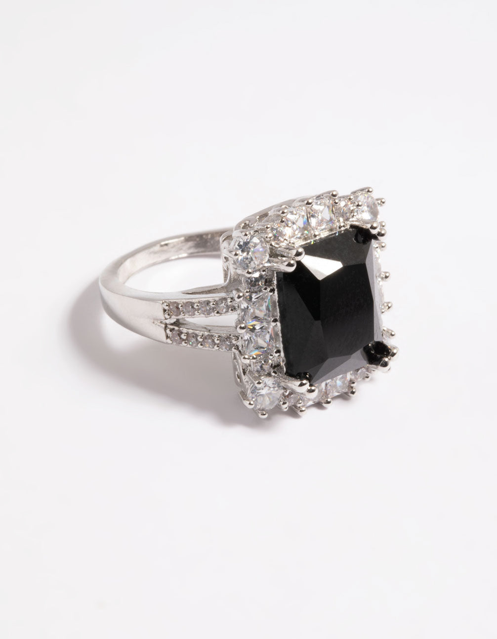 Showcasing a cubic zirconia ring with emerald cut stone in black and silver tones front view
