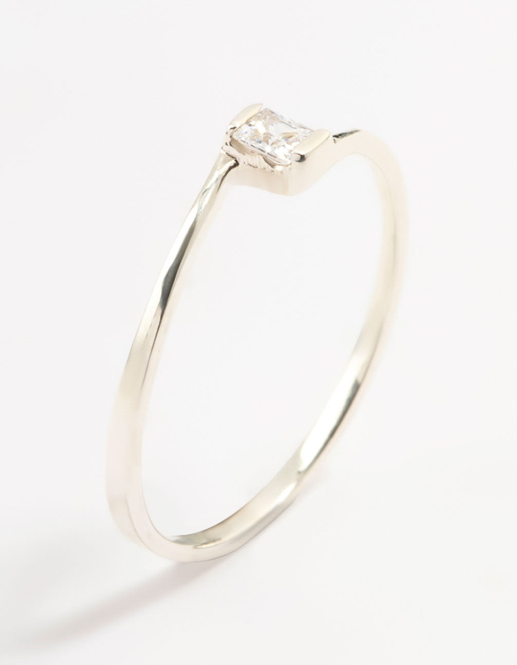 Showcasing a mini square ring crafted from sterling silver featuring cubic zirconia detailing side detail view