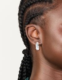 Featuring silver plated twisted hoop earrings with statement design on ear view - link has visual effect only