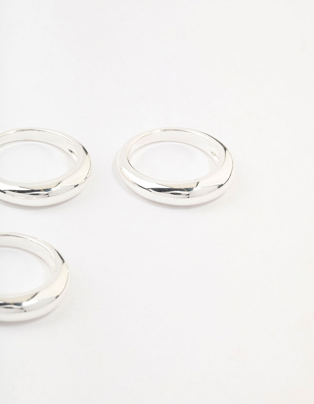 Crafted from silver plated material, this medium dome rings 3-pack shown in close up view