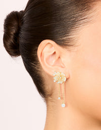 Showcasing gold plated acrylic flower pearl drop earrings with statement style on ear view - link has visual effect only