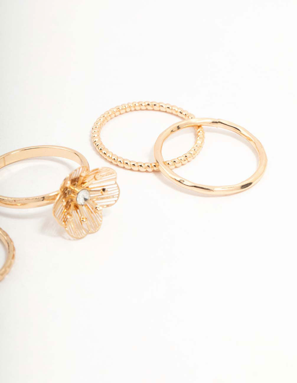 Crafted from gold with diamante wire flower design in a dainty 4-pack side detail view