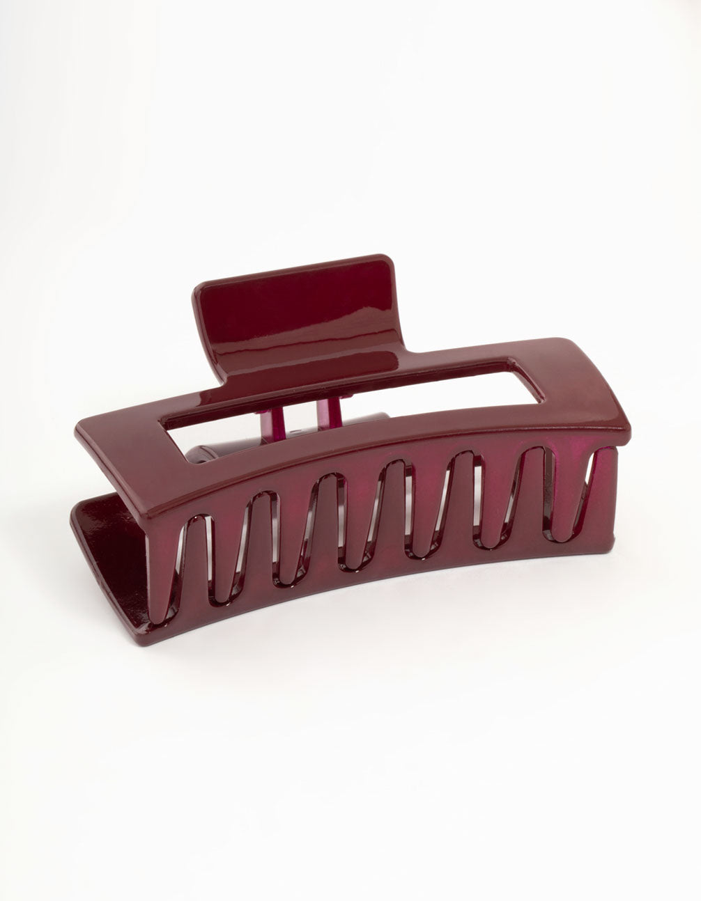 Featuring a shiny large burgundy coated claw clip in maroon side view
