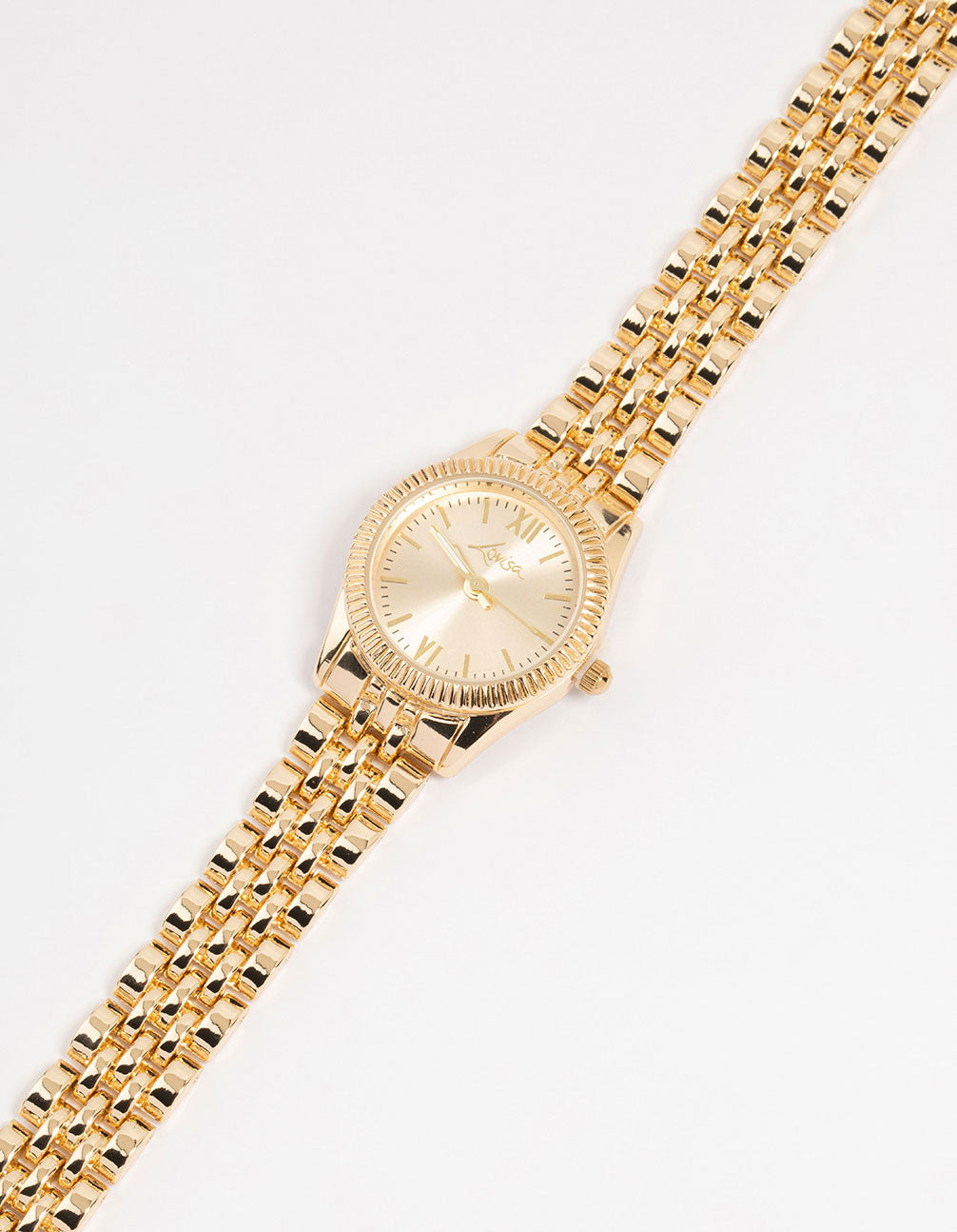 Featuring a small round watch with gold tone dial, roman numerals, link band strap in gold for women formal occasions watch face detail view