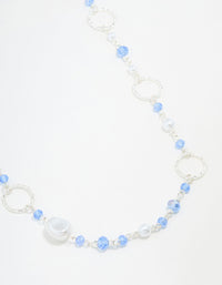 Silver Crater Hoop & Blue Beaded Necklace - link has visual effect only