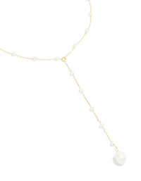Showcasing waterproof gold plated stainless steel pearl Y-necklace with dainty design close up view - link has visual effect only