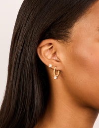 Showcase your style with dainty waterproof cubic zirconia stainless steel mini earrings in a 2-pack on ear view - link has visual effect only