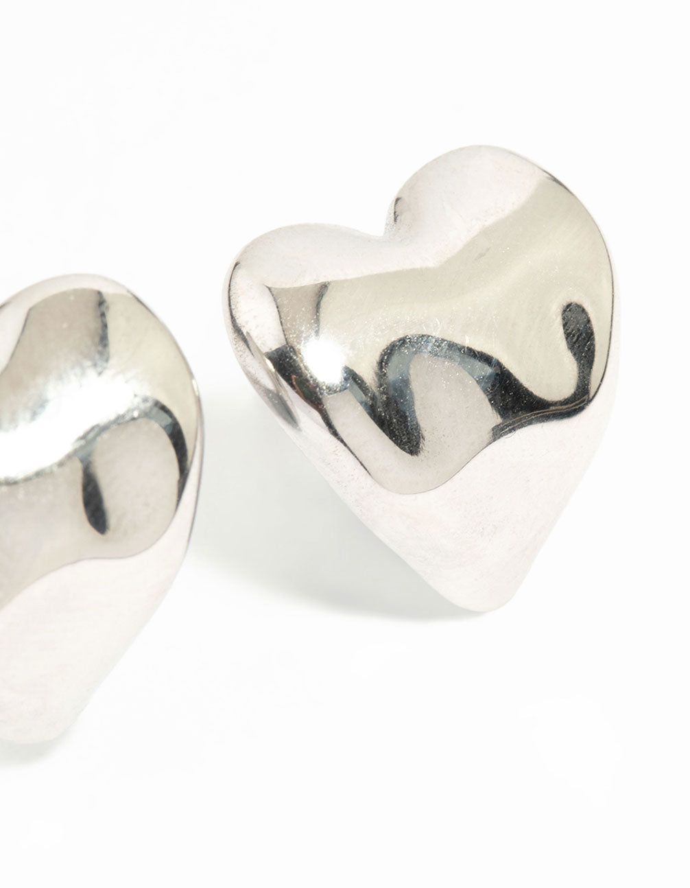 Highlighting waterproof stainless steel molten heart stud earrings in dainty silver construction post detail view