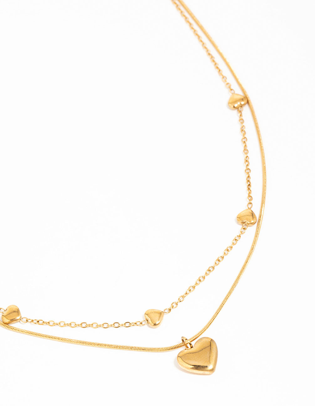 Beautifully designed waterproof gold plated stainless steel heart pendant layered necklace with charm accents close up view