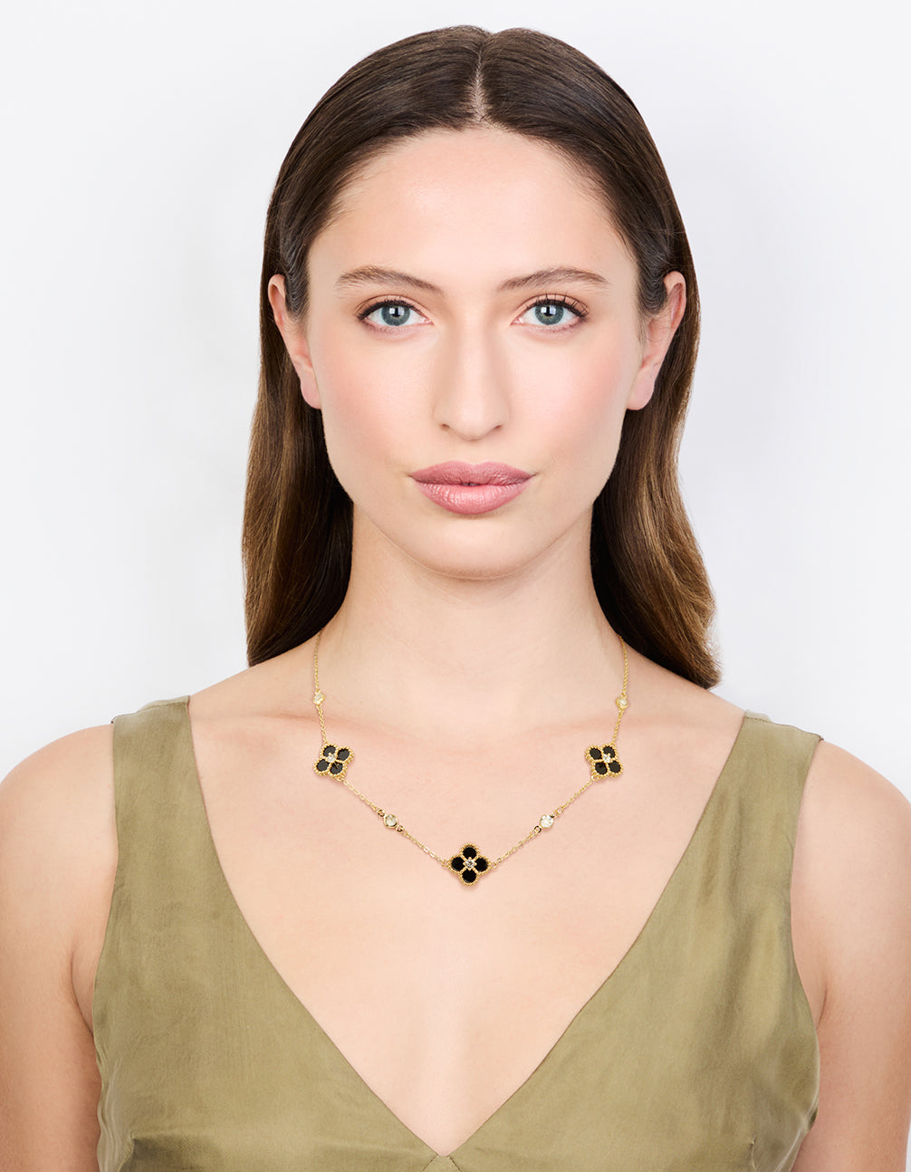 Designed with gold plated cubic zirconia black flower pendant necklace featuring floral and crystal accents on model view