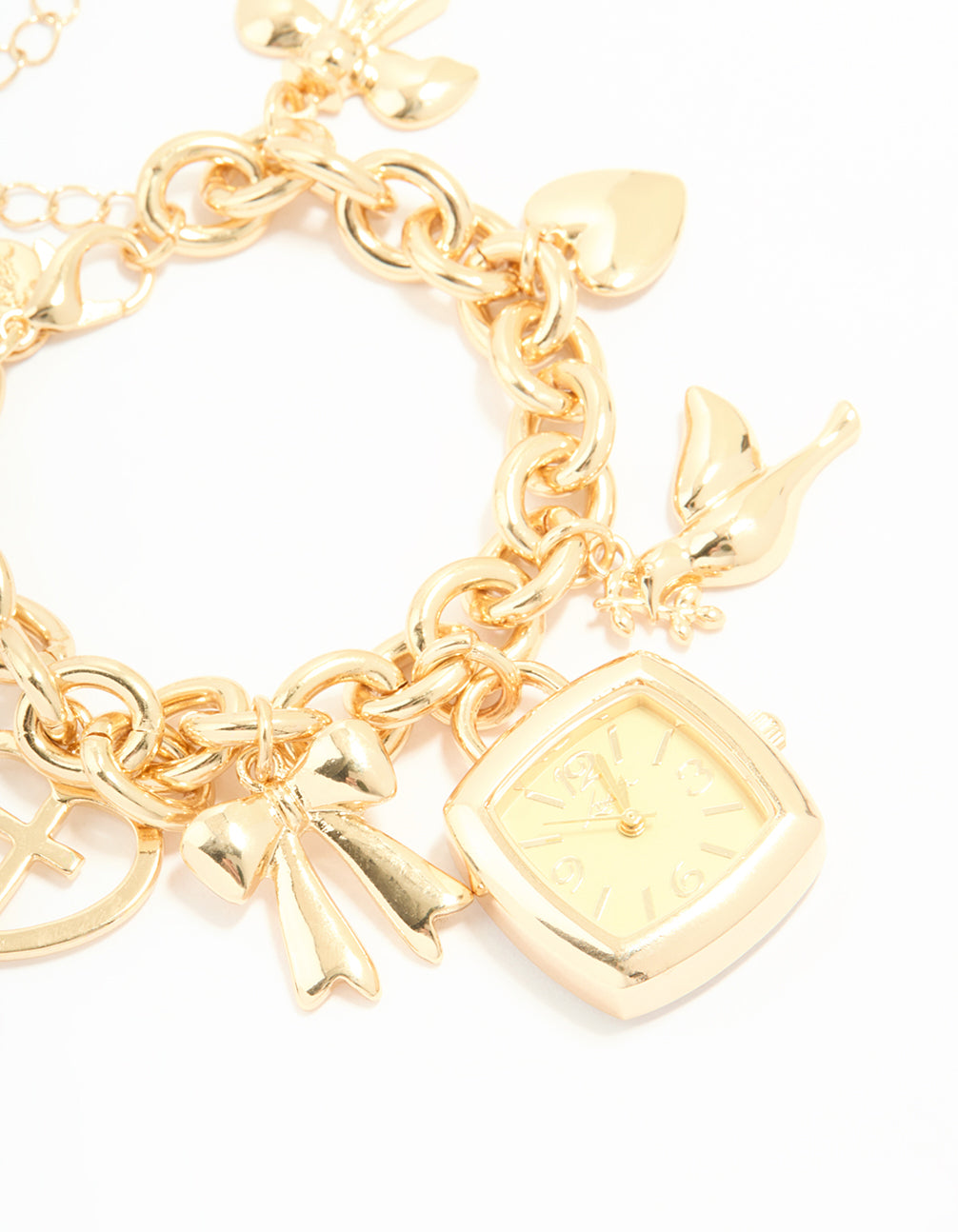 Crafted from gold, this statement charm bracelet watch displays bird, bow, heart, cross and charm details with yellow square dial, women's casual analog timepiece on link band watch face detail view